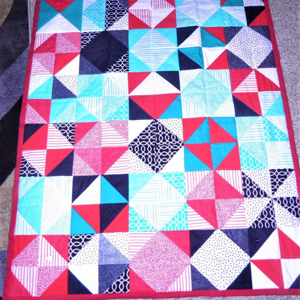 TURQUOISE MULTI-COLORED GEOMETRIC-STYLE QUILT